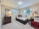 Cozy bedroom with natural light, comfortable furnishings, and stylish décor at 6664 Gray St, Arvada, CO 80003