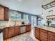 Well-appointed kitchen with granite countertops, stainless steel appliances, and ample cabinet space, perfect for cooking at 6664 Gray St, Arvada, CO 80003