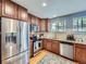 Modern kitchen featuring stainless steel appliances, granite countertops, and stylish cabinetry for a functional design at 6664 Gray St, Arvada, CO 80003