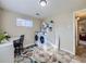 Convenient laundry room with washer, dryer, workspace, and storage shelving at 6664 Gray St, Arvada, CO 80003