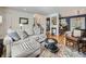 Inviting living room featuring stylish decor, hardwood floors, and an open layout, perfect for relaxation and entertaining at 6664 Gray St, Arvada, CO 80003