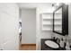Bathroom featuring granite counters, modern fixtures, and an open doorway to the hallway at 2351 Federal Blvd # 102, Denver, CO 80211
