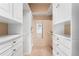 A spacious walk-in closet with custom shelving, drawers and access to the home's natural light at 2351 Federal Blvd # 102, Denver, CO 80211