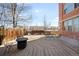 Outdoor deck with black metal furniture and a fire pit at 2351 Federal Blvd # 102, Denver, CO 80211