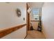 Hallway featuring a wooden rail with coat hooks and art decor at 2351 Federal Blvd # 102, Denver, CO 80211