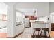 Bright kitchen featuring stainless steel appliances, breakfast bar, and easy access to living areas at 2351 Federal Blvd # 102, Denver, CO 80211