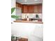 Well-lit kitchen features cherry cabinets, stainless steel appliances, and a tiled backsplash at 2351 Federal Blvd # 102, Denver, CO 80211