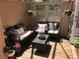 Relaxing covered patio features outdoor seating, potted plants, and hanging flower baskets at 2351 Federal Blvd # 102, Denver, CO 80211