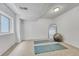 Carpeted basement featuring natural light, mirror and workout equipment ready for use at 4726 S Taft St, Morrison, CO 80465