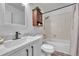 Bright bathroom featuring a modern vanity, new fixtures, and updated shower at 4726 S Taft St, Morrison, CO 80465