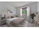 Comfortable bedroom with soft carpet, neutral walls, and ample natural light at 4726 S Taft St, Morrison, CO 80465
