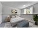 Cozy bedroom with plush bed, stylish decor, and plenty of natural light at 4726 S Taft St, Morrison, CO 80465