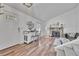 Inviting living room with a bar, hard wood floors, comfortable seating, and fireplace at 4726 S Taft St, Morrison, CO 80465