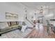 Inviting living room with hard wood floors, comfortable seating, and open floorplan at 4726 S Taft St, Morrison, CO 80465