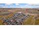 Aerial view of a neighborhood positioned near the Coyote Creek Golf Course and Aims Community College at 2405 Horse Shoe Cir, Fort Lupton, CO 80621