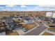 Overhead shot of a suburban neighborhood, highlighting its community layout and housing styles at 2405 Horse Shoe Cir, Fort Lupton, CO 80621