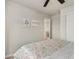 Cozy bedroom featuring soft floral bedding and charming decor at 2405 Horse Shoe Cir, Fort Lupton, CO 80621