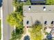 Aerial view of the home's roof, surrounding trees, and a glimpse of the neighborhood street at 1810 Youngfield Ct # A, Golden, CO 80401