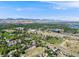 Wide aerial view of office buildings, homes, and the mountains in the distance create a scenic neighborhood backdrop at 1810 Youngfield Ct # A, Golden, CO 80401
