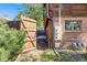 Backyard view to the home's patio featuring chairs, table, and outdoor dining area at 1810 Youngfield Ct # A, Golden, CO 80401