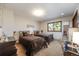 Bedroom with two twin beds, each with stylish metal frames, and natural light streaming through the window at 1810 Youngfield Ct # A, Golden, CO 80401