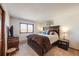 Comfortable bedroom with a decorative accent, and a large window at 1810 Youngfield Ct # A, Golden, CO 80401