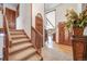 Welcoming foyer with staircase, hardwood floors, and elegant details at 1810 Youngfield Ct # A, Golden, CO 80401