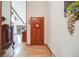 Inviting foyer with hardwood floors, a decorative front door, and glimpse into the home's open layout at 1810 Youngfield Ct # A, Golden, CO 80401