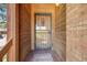 Close-up of the front door with decorative security door, and welcome mat, showing a charming entryway at 1810 Youngfield Ct # A, Golden, CO 80401
