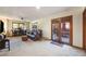 Spacious living room featuring a leather sofa, ceiling fan, and a glass door to the outside at 1810 Youngfield Ct # A, Golden, CO 80401