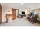 Living room featuring a ceiling fan, study, and comfortable seating at 1810 Youngfield Ct # A, Golden, CO 80401