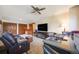 Comfortable seating in the living room with a ceiling fan, with a large desk off to the side at 1810 Youngfield Ct # A, Golden, CO 80401