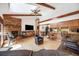 Inviting living room featuring a brick fireplace, vaulted ceilings, and an open floor plan to the kitchen at 1810 Youngfield Ct # A, Golden, CO 80401
