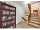 Carpeted stairwell next to built in bookcase at 1810 Youngfield Ct # A, Golden, CO 80401