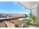 Relaxing balcony seating area offers clear views of the area, enhanced by unique cactus decorations at 920 E Plum Creek Pkwy # 306, Castle Rock, CO 80104