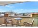 Scenic balcony showcasing breathtaking views of the city and snow-covered mountains in the distance at 920 E Plum Creek Pkwy # 306, Castle Rock, CO 80104