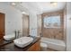 Bathroom with double sinks and bathtub shower combo at 11080 W Walker Dr, Littleton, CO 80127