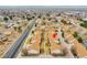 An aerial view of a row of townhomes with brown roofs in a suburban neighborhood at 2616 E Egbert St, Brighton, CO 80601