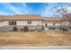 The backyard has a partial brick wall, and a small fenced area at 2616 E Egbert St, Brighton, CO 80601