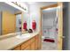 Bathroom features a white sink vanity and a separated shower with a sliding glass door at 2616 E Egbert St, Brighton, CO 80601