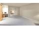 Bedroom with mirrored closet doors, neutral carpet and walls, and a desk nook at 2616 E Egbert St, Brighton, CO 80601