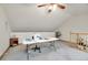 Craft room features a sewing machine, skylights, and ample workspace at 2616 E Egbert St, Brighton, CO 80601