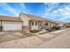 Single story brick home showcasing an attached two car garage, front yard and concrete driveway at 2616 E Egbert St, Brighton, CO 80601