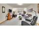 Inviting living room with fireplace, bay window, and comfortable seating arrangement at 2616 E Egbert St, Brighton, CO 80601