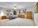 Spacious bedroom featuring neutral walls, a ceiling fan, a window and carpeted flooring at 2616 E Egbert St, Brighton, CO 80601