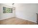 Bright dining room featuring laminate wood flooring and a modern orb chandelier at 6527 S Ammons Ct, Littleton, CO 80123