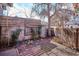 Serene backyard space with a wooden fence, garden bed, and an inviting outdoor seating area at 2541 Cherry St, Denver, CO 80207