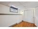 Basement room with hardwood floors, a small window and closet with sliding doors at 2541 Cherry St, Denver, CO 80207