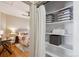 Cozy bedroom features a closet with built-in shelving and gray and white striped storage bins at 2541 Cherry St, Denver, CO 80207