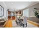 Elegant dining area with hardwood floors and view into updated kitchen at 2541 Cherry St, Denver, CO 80207